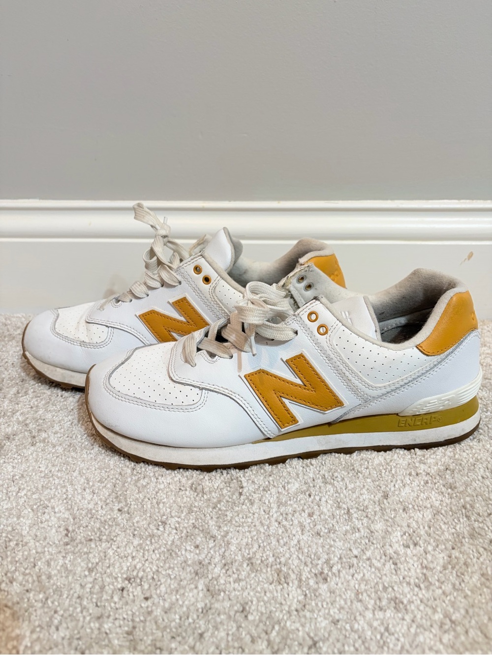 New Balance 574s White Sneakers with Mustard Accents